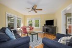 Comfortable living room with smart TV and sofa sleeper